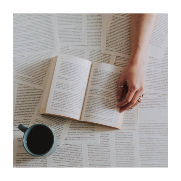 an open  book and a cup of coffee