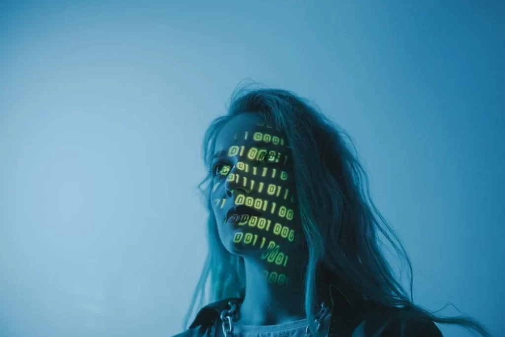 Woman in dark room with binary numbers