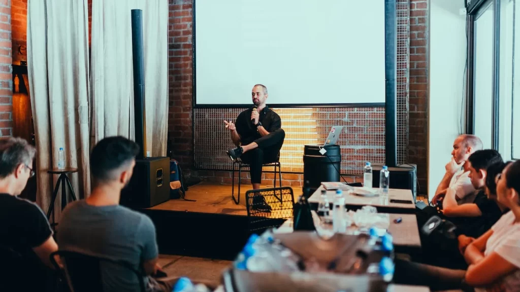 Giving a speech in front of a small crowd